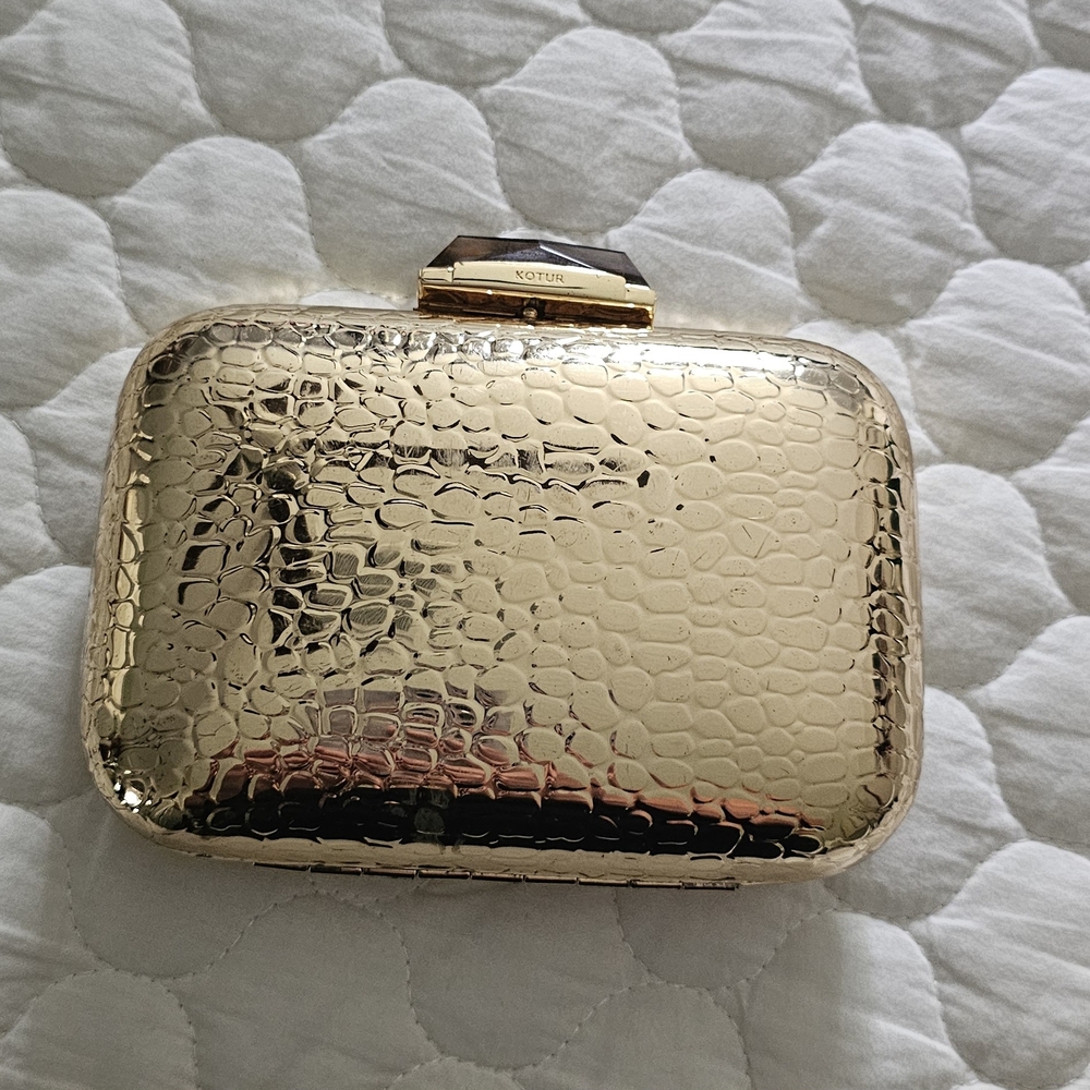 Gold Textured Clutch By Kotur